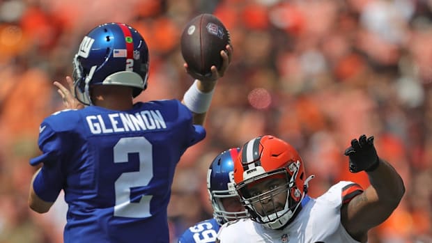 Cleveland Browns defensive tackle Jordan Elliott (96) rushes New York Giants quarterback Mike Glennon (2) during the first half of an NFL preseason football game, Sunday, Aug. 22, 2021, in Cleveland, Ohio. [Jeff Lange/Beacon Journal] Brownsgiants 4